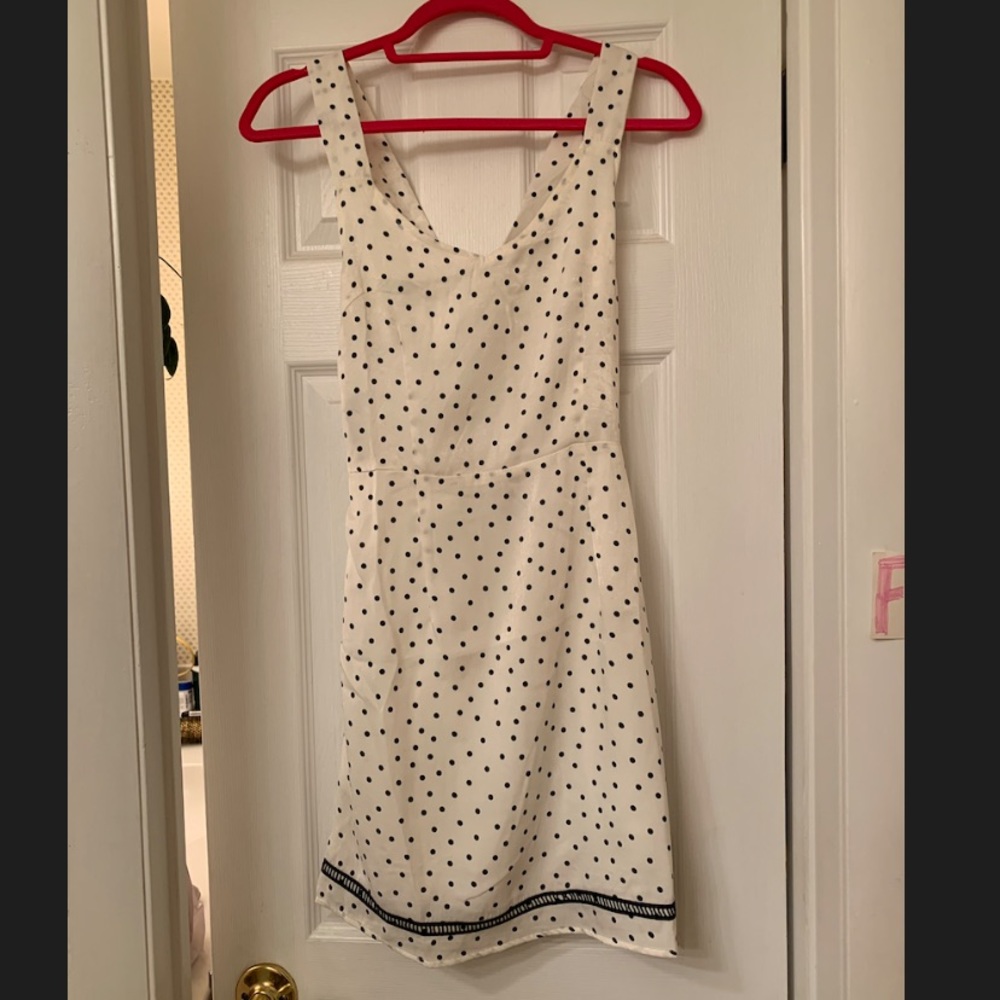 White dress with black polka dots; cross back